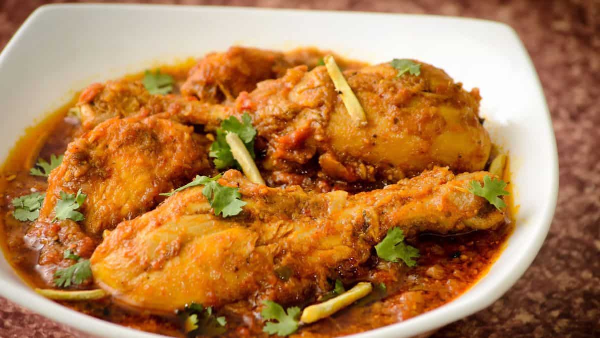 Chicken bhuna in a white bowl.