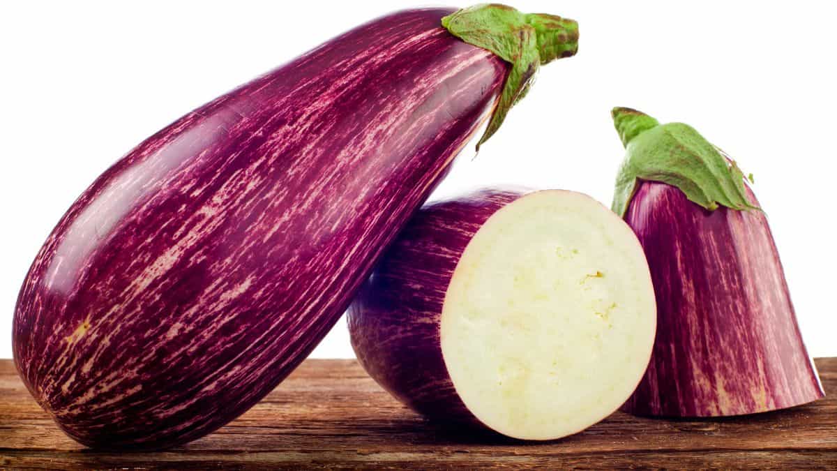 Whole and cut gandia eggplant.