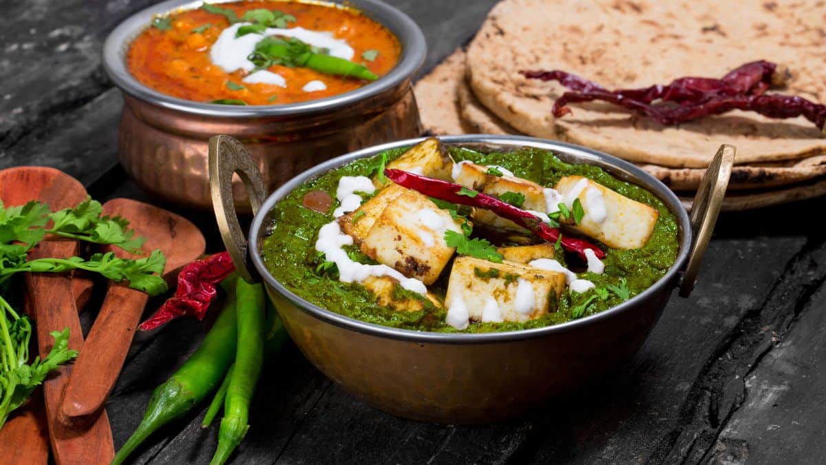 Saag paneer served with naan bread.