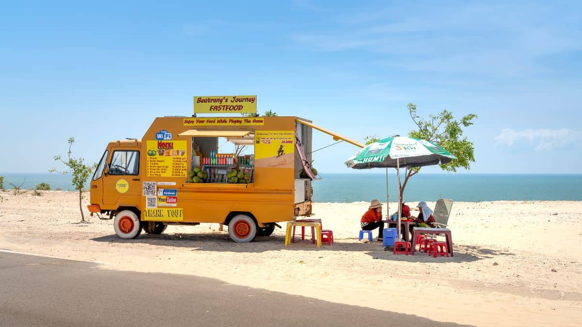 A food truck at the beach.