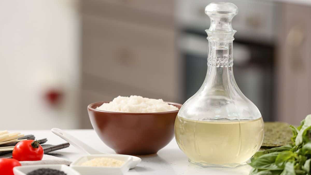 A bottle of rice vinegar on a kitchen counter.