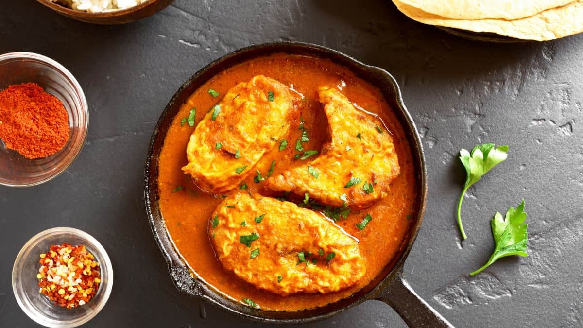 Fish curry in a skillet.