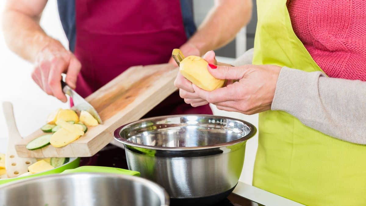 Man and woman cooking.