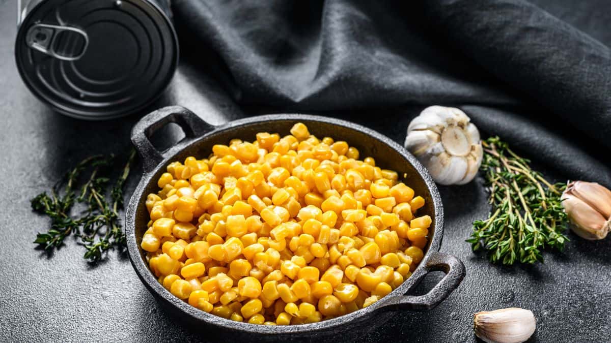 Corn kernels in a small black bowl.