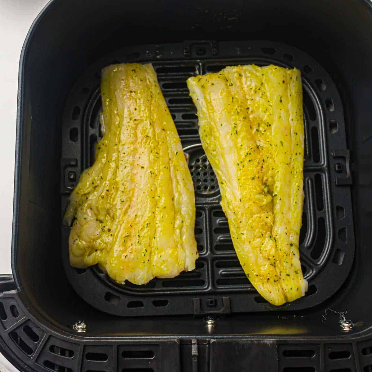 Fillets placed in air fryer.