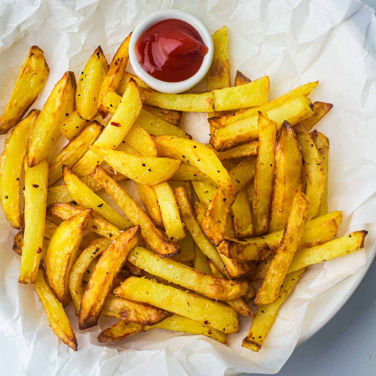 Air fryer fries on a white plate.