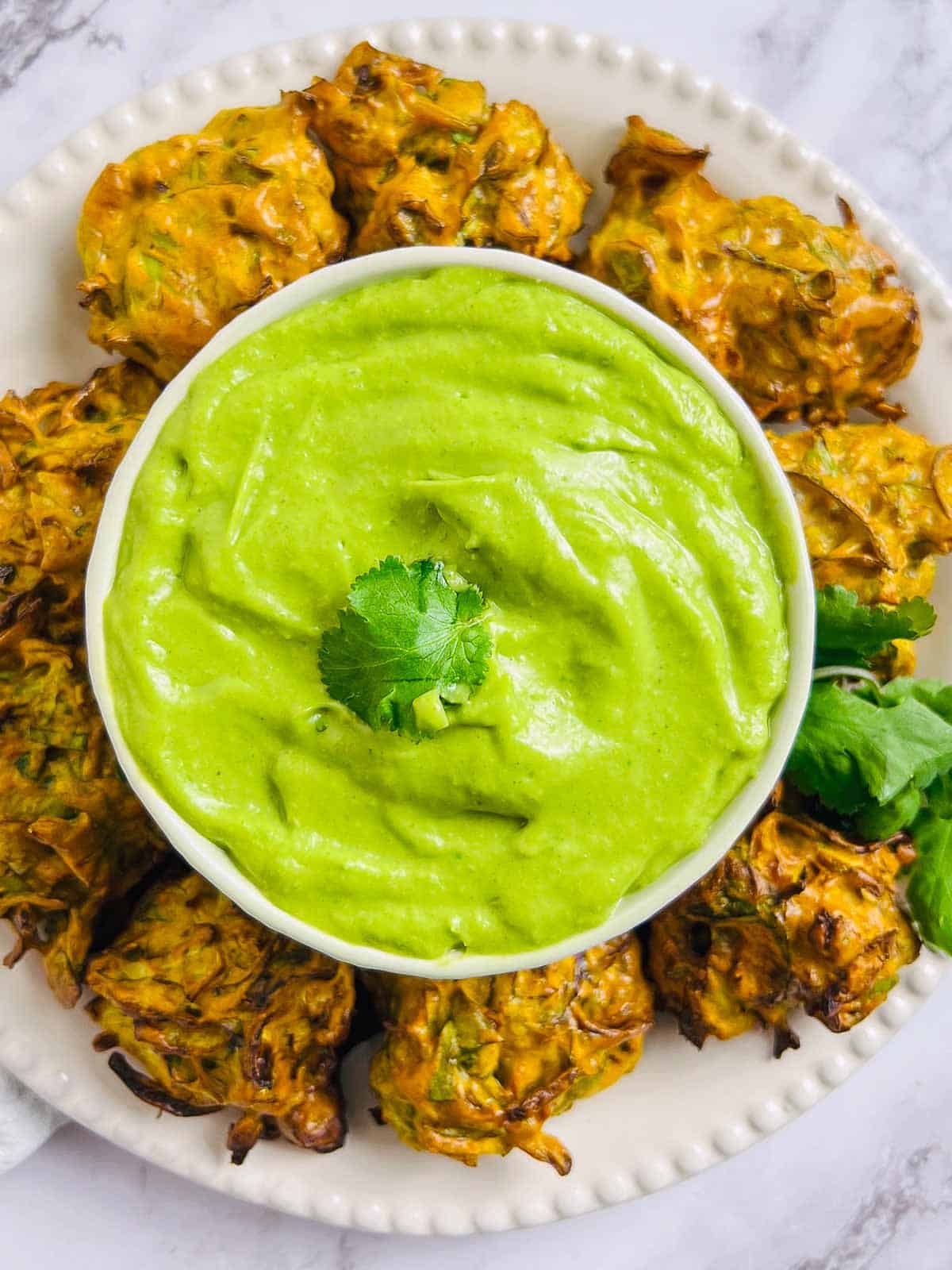 Avocado cilantro chutney served with pakoras.