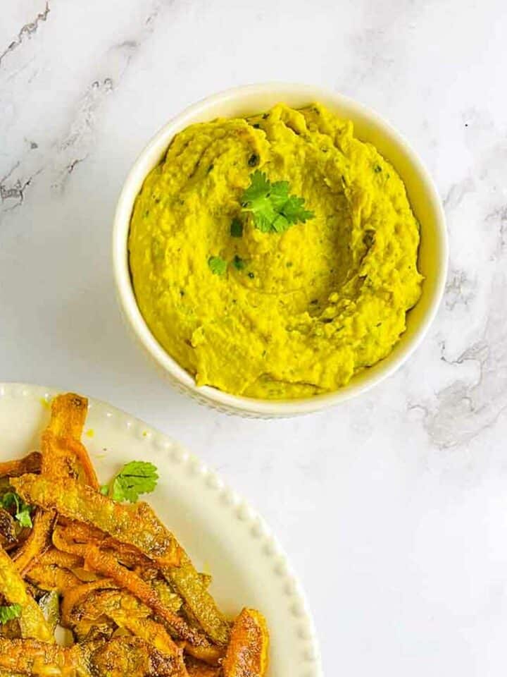 Curried white bean dip served with vegetable chips.