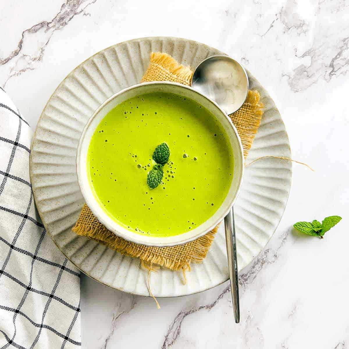 Mint chutney in a white bowl.