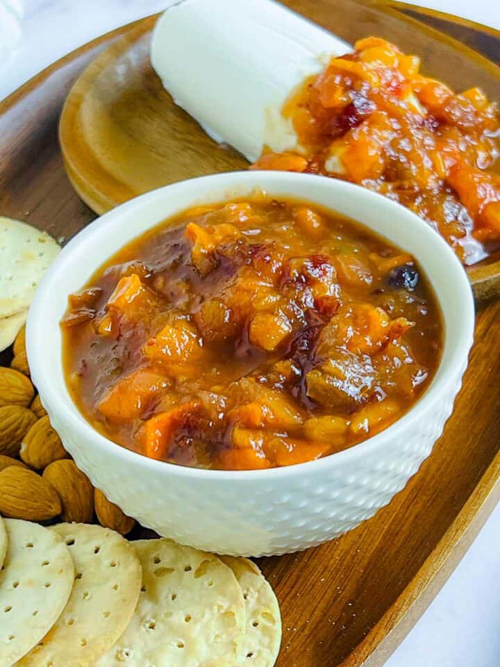 Persimmon cranberry chutney served with crackers and cheese.