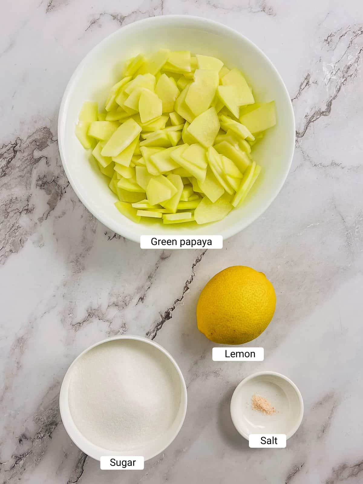 Ingredients to make plastic chutney on a marble surface.