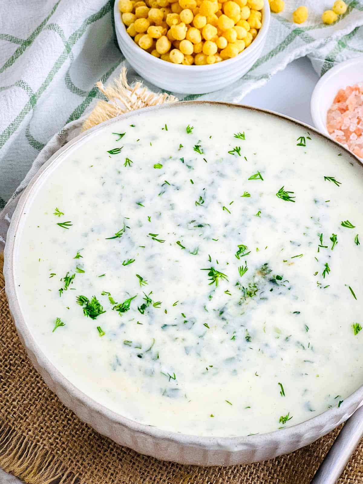 Close up of spinach dill raita bowl.