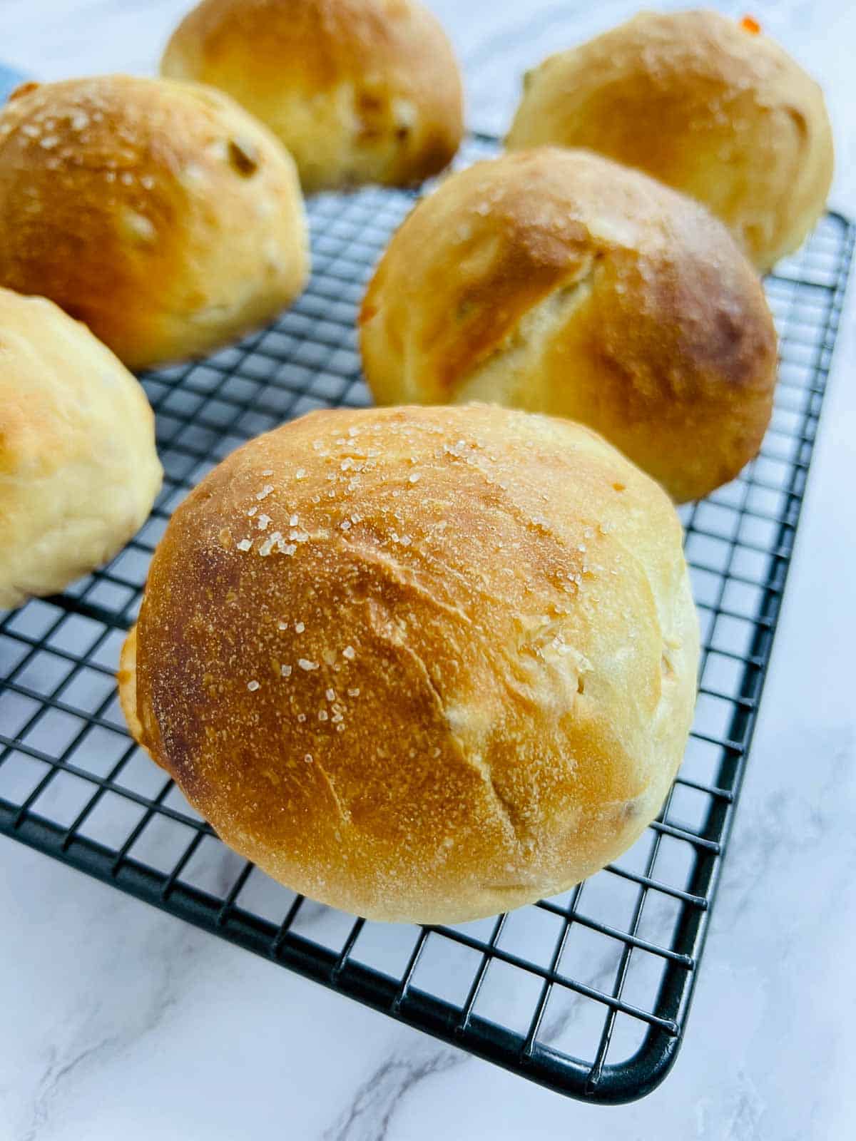 Close up of baked bun on a wire rack.