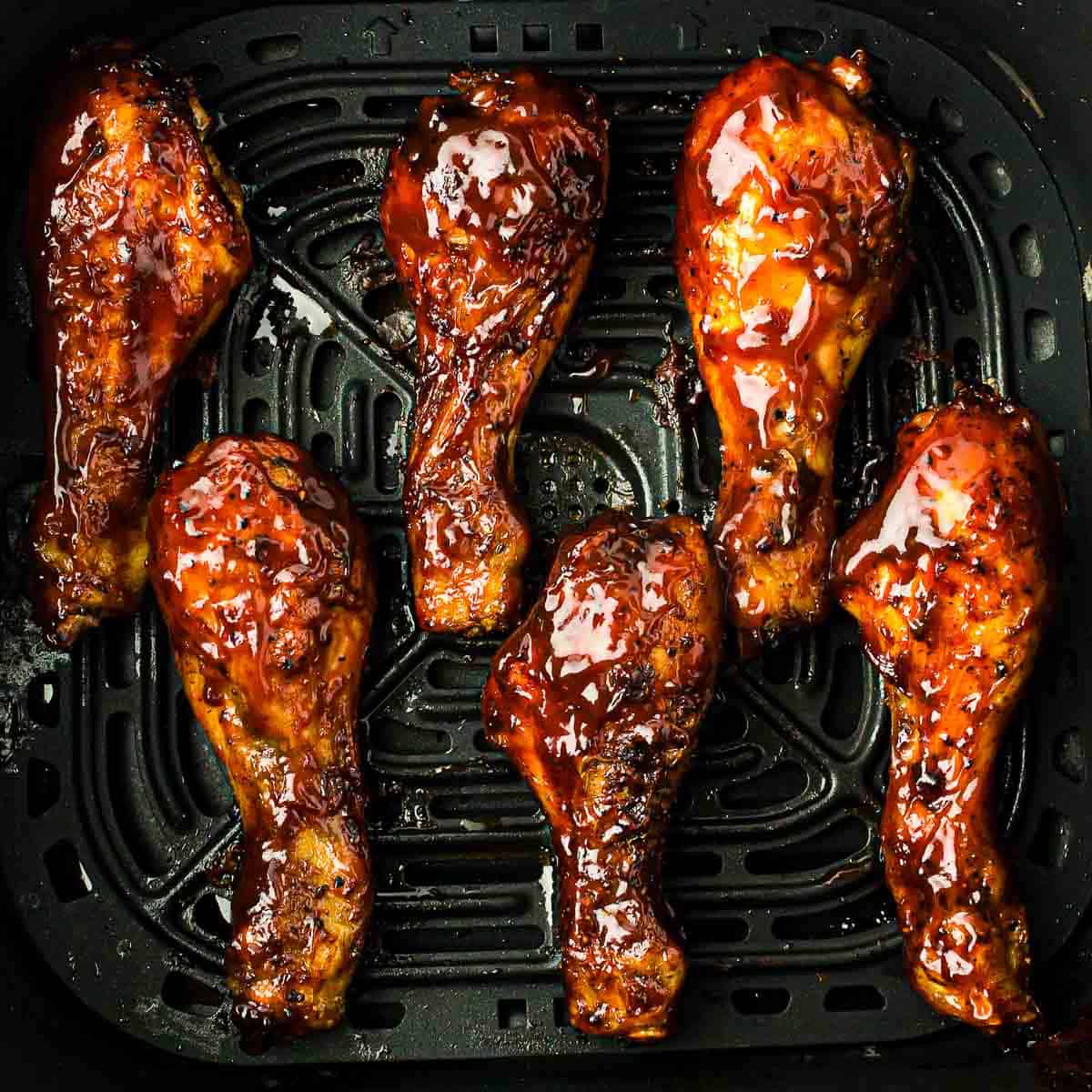 Chicken drumsticks brushed with bbq sauce.