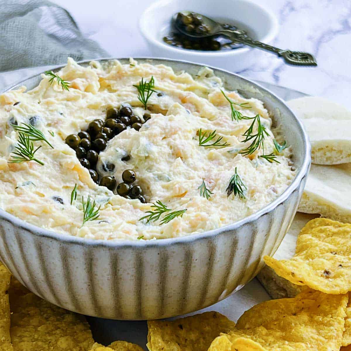 Salmon egg dip served with chips.