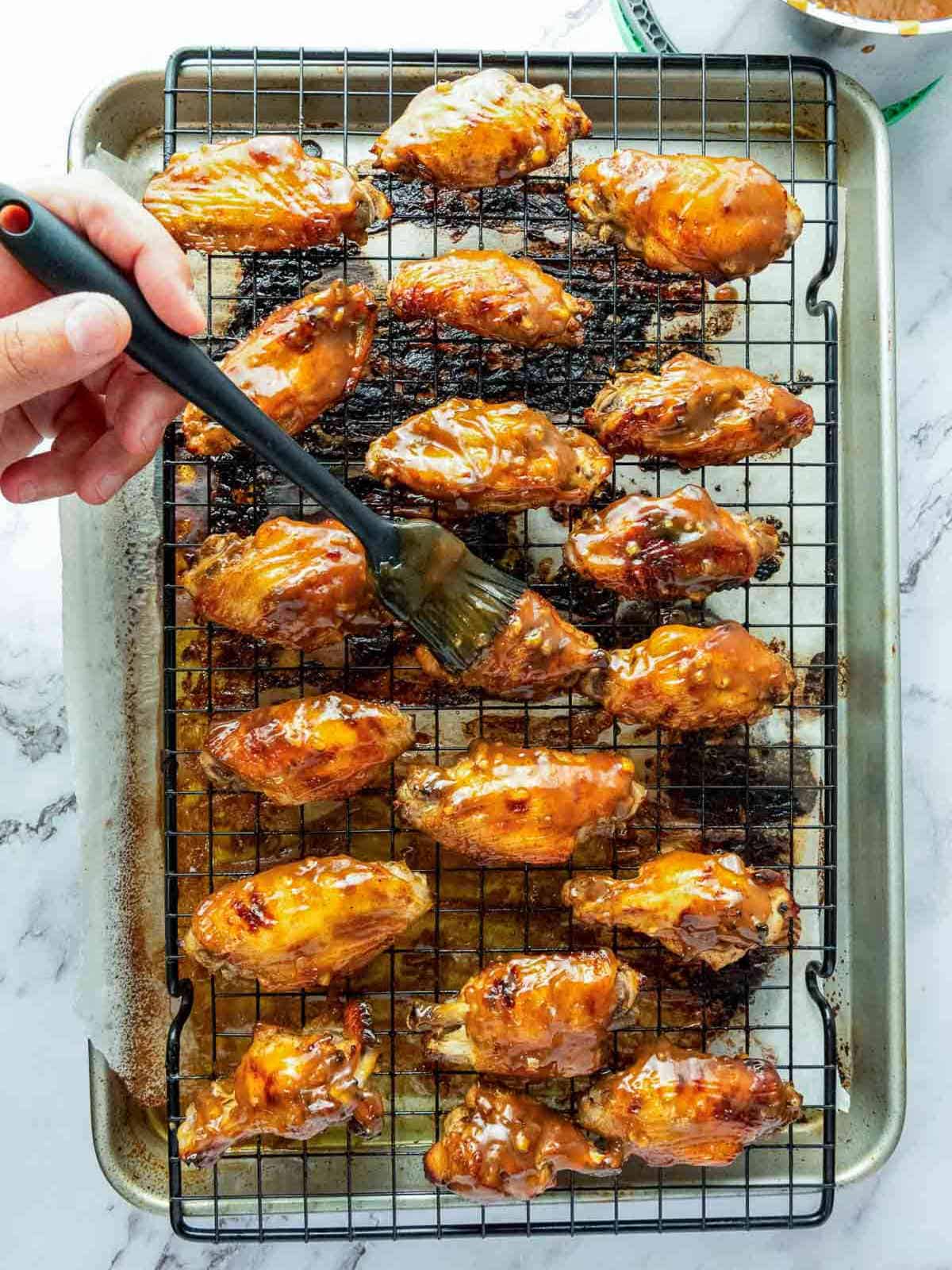 Baked chicken wings brushed with sticky sauce.