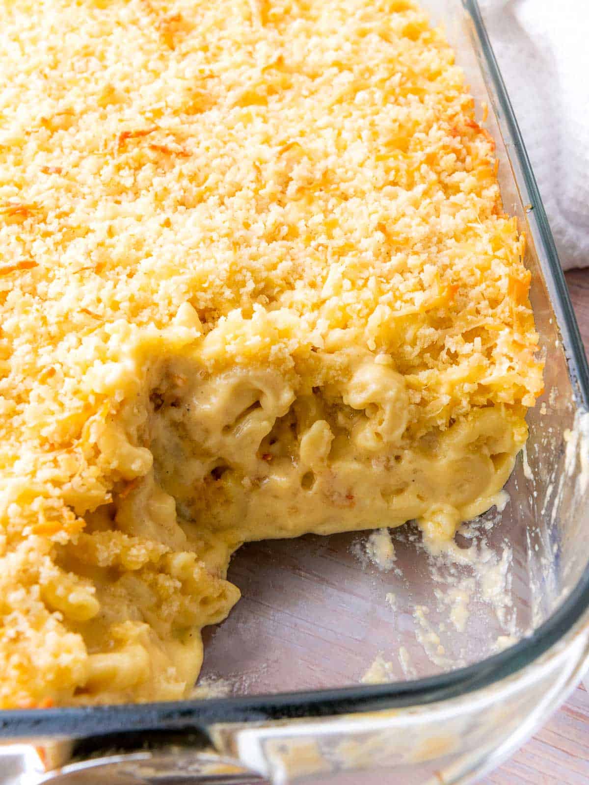 Mac and cheese in baking dish after slicing.