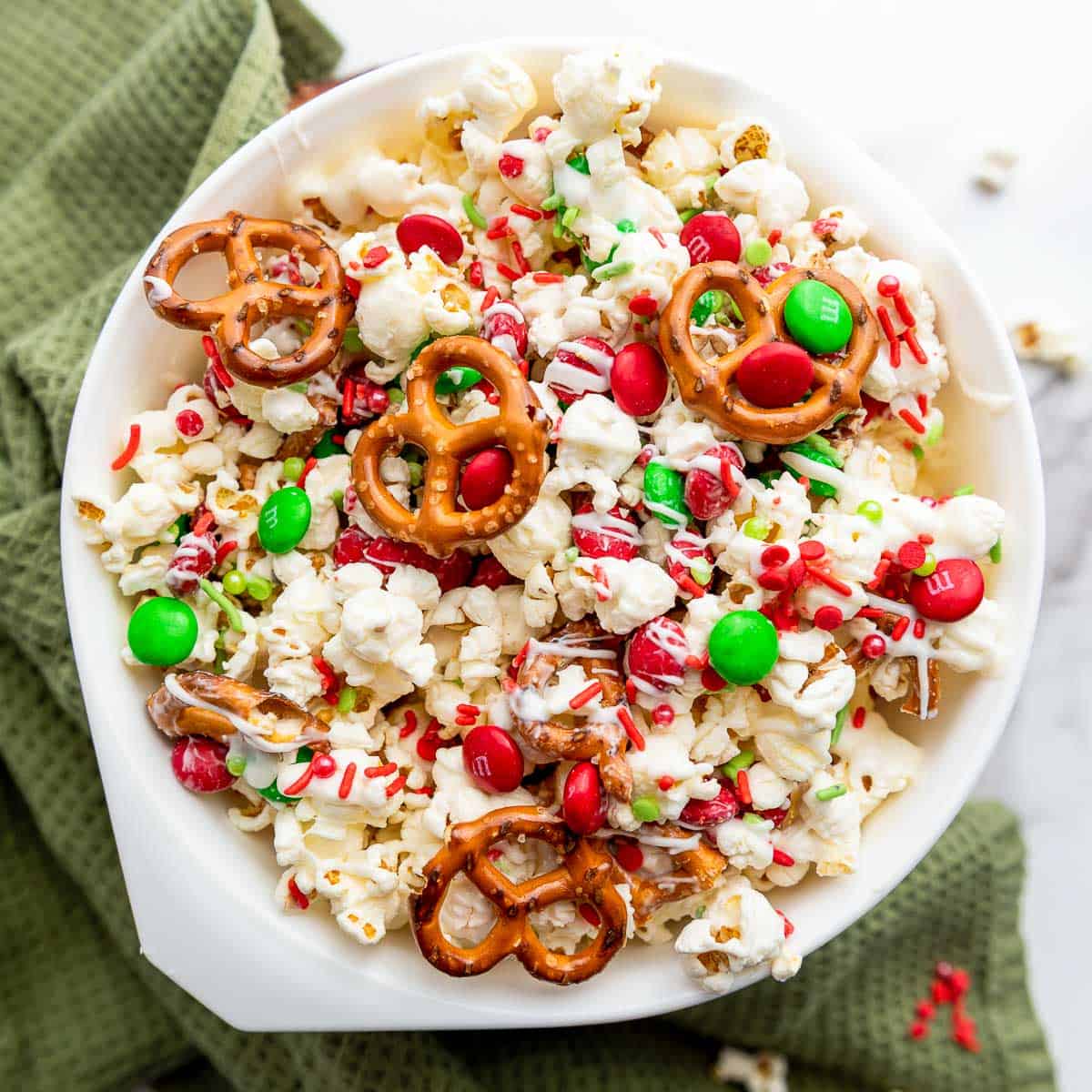 Christmas popcorn in a white bowl.