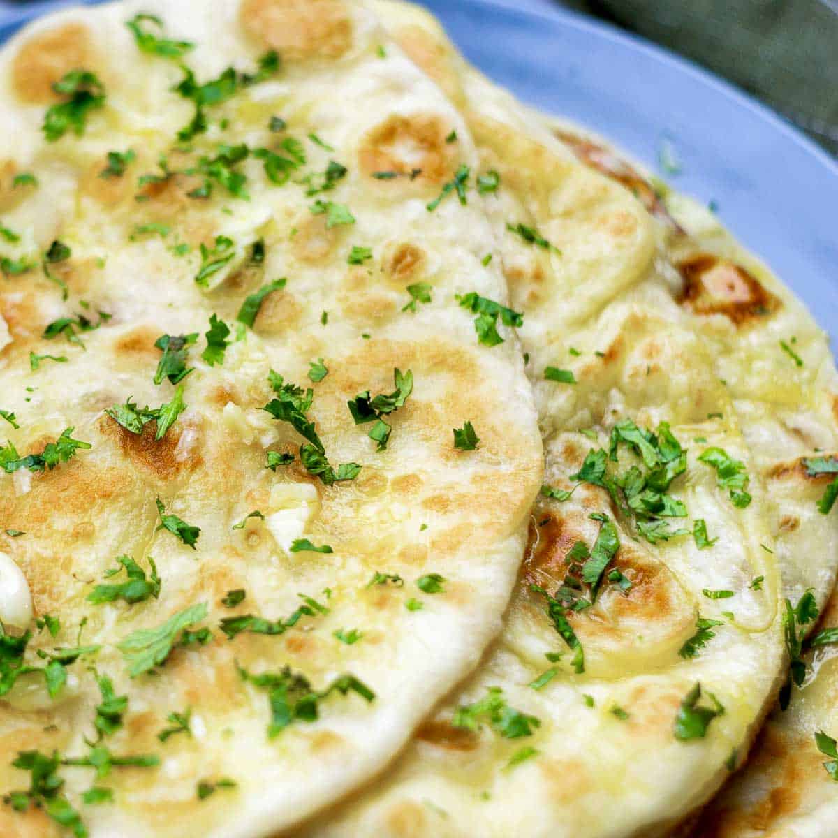 Close up of garlic naan showing the texture.