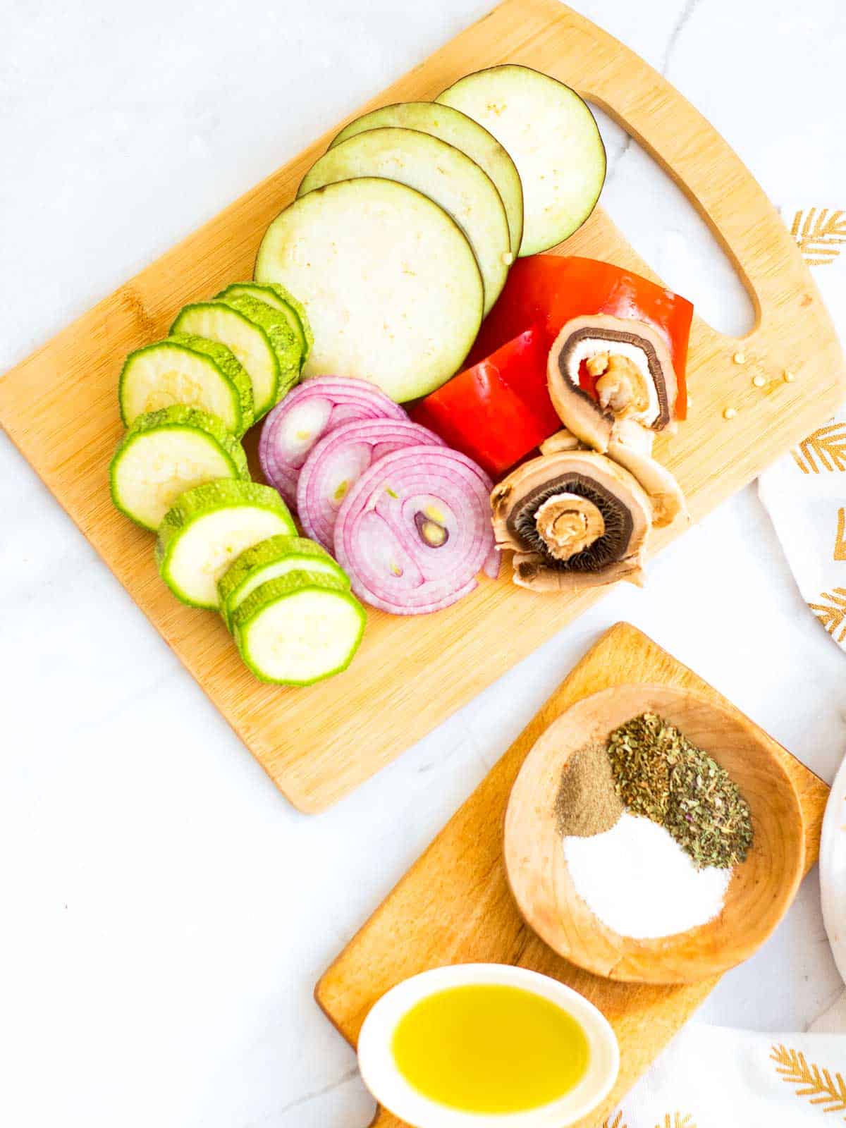 Sliced vegetables on a wooden board.