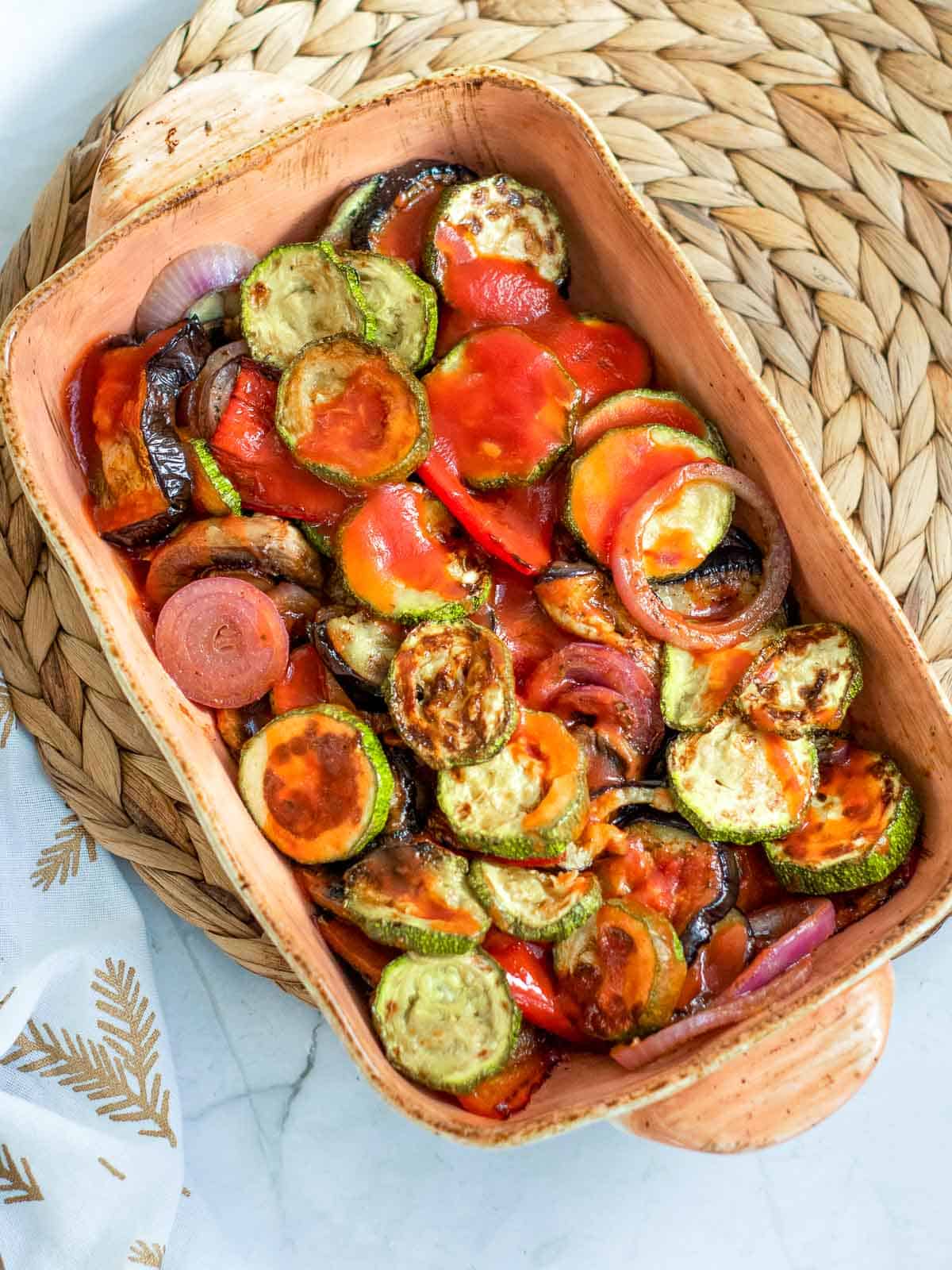 Veggies in a casserole dish for baking.