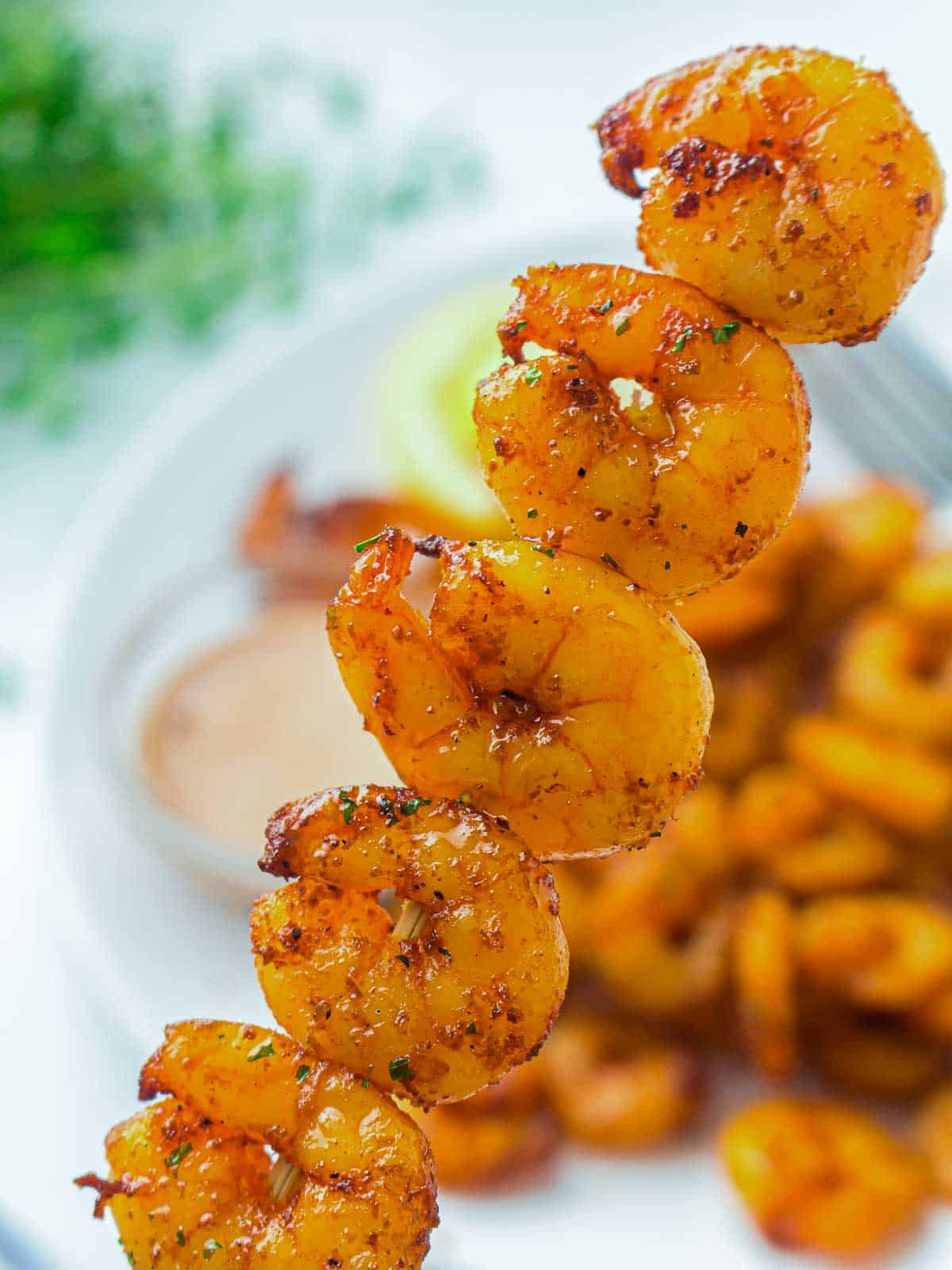 Roasted shrimp threaded into skewers.