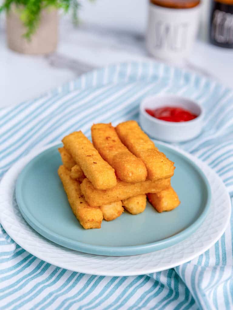 Potato cheese sticks served with ketchup.