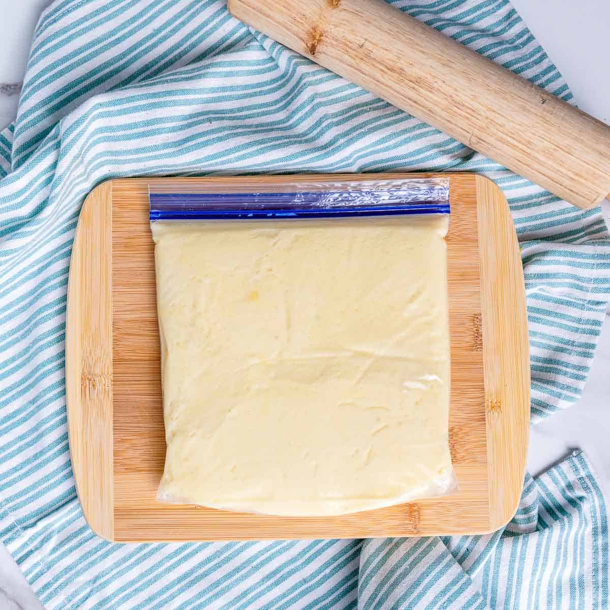 Shape the dough in a ziplock bag and freeze it.