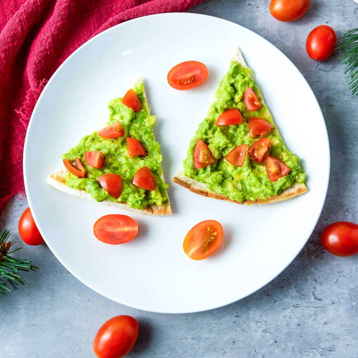 Christmas pita trees on a white plate.