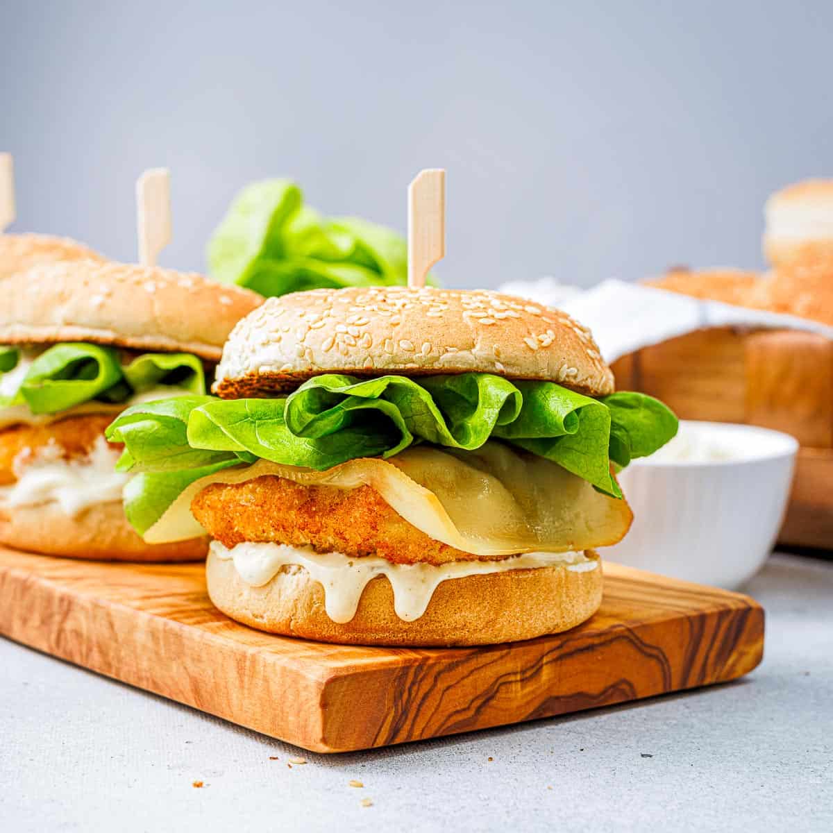 Fish burger on a wooden board.