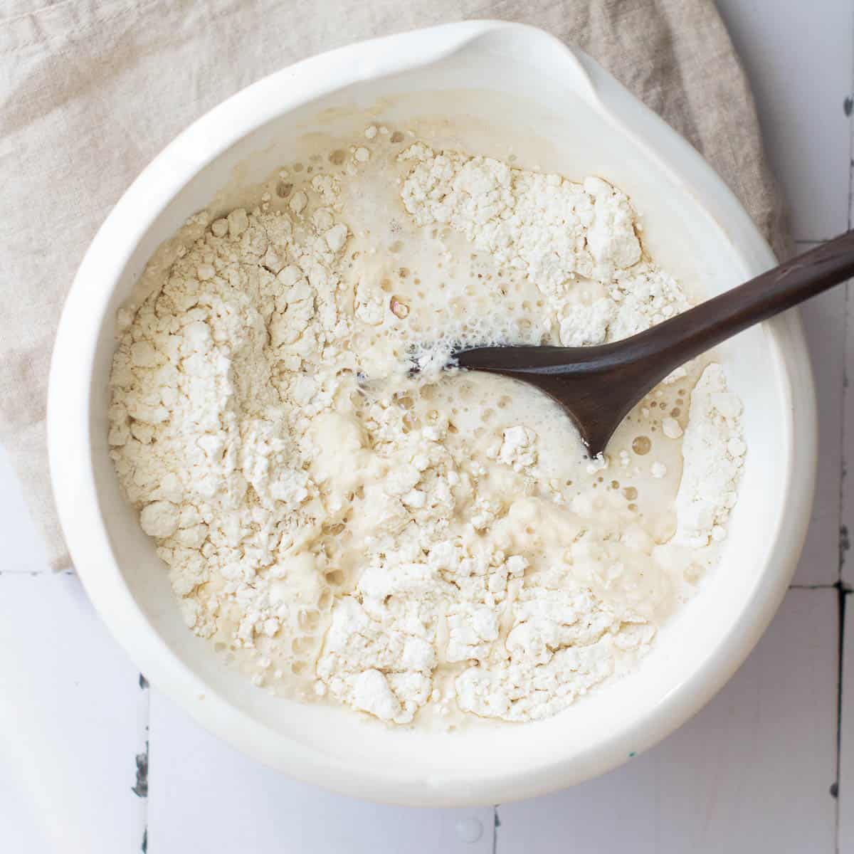 Wet and dry ingredients in a mixing bowl.