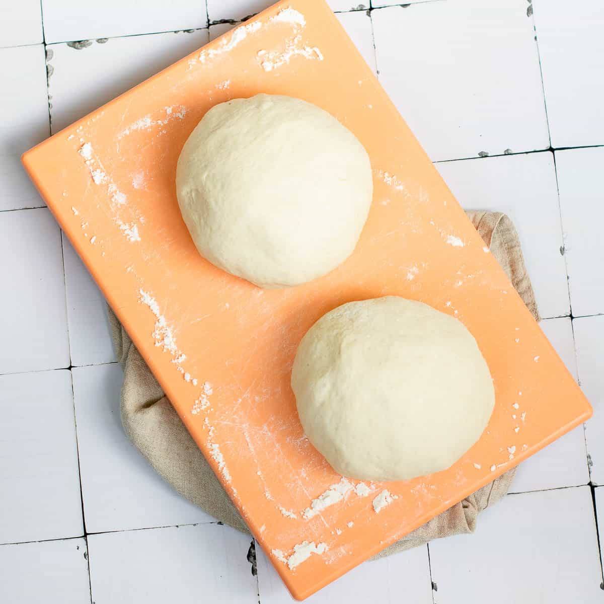 Dough divided into two equal part and shaped into rounds.