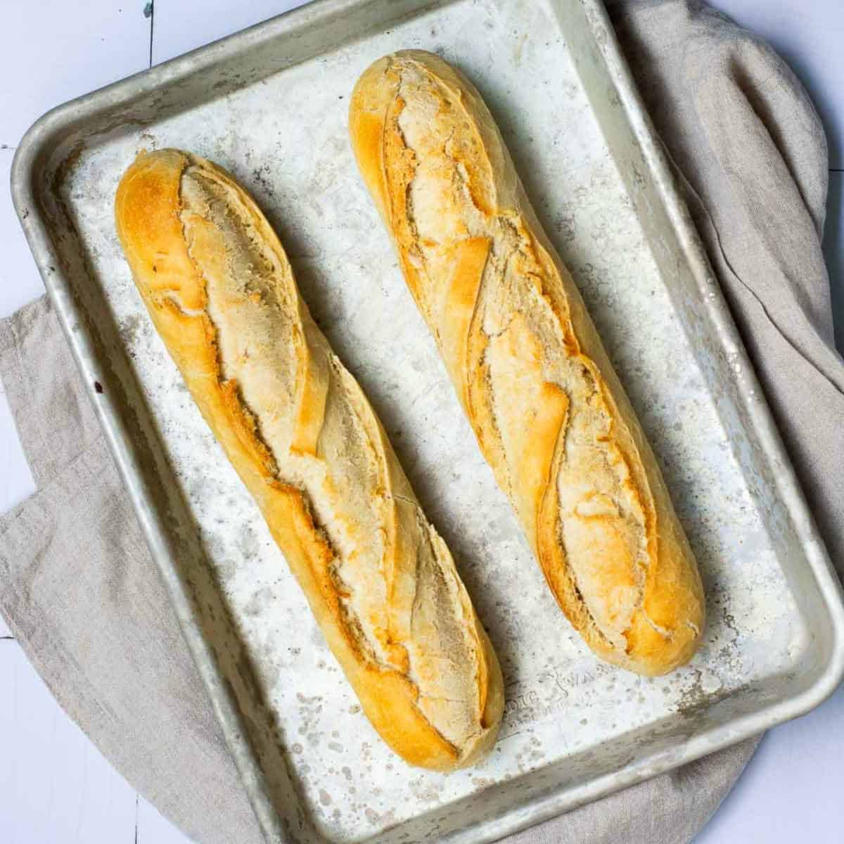 Baked baguettes on the baking sheet.