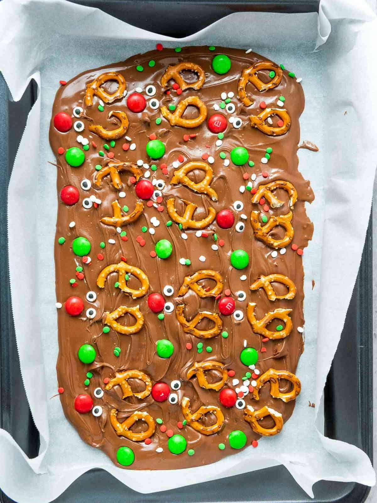 Decorated with pretzels, M&Ms, sprinkles, and candy eyes.