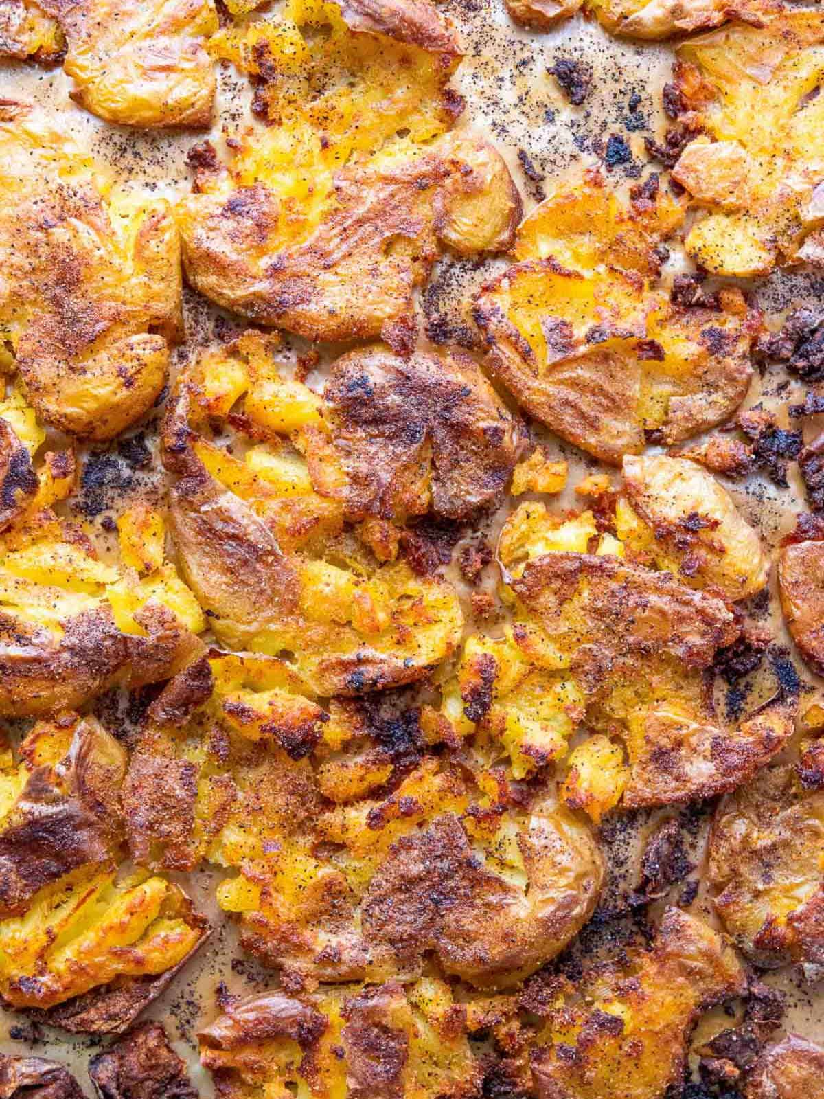 Close up of roasted potatoes on the baking sheet.