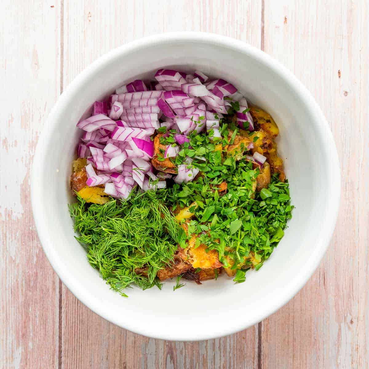 Salad ingredients in a mixing bowl.