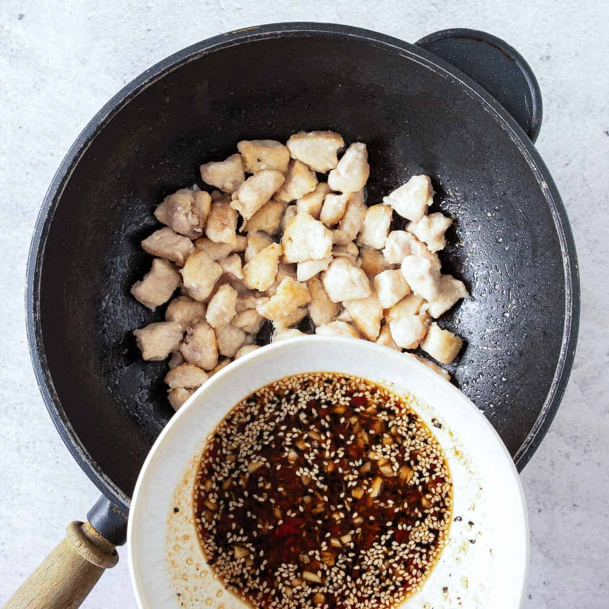 Chicken cooked in a wok.