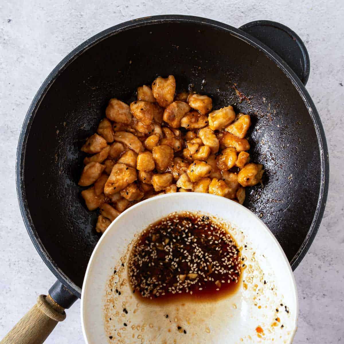 Cooked chicken simmered with the stir fry sauce.