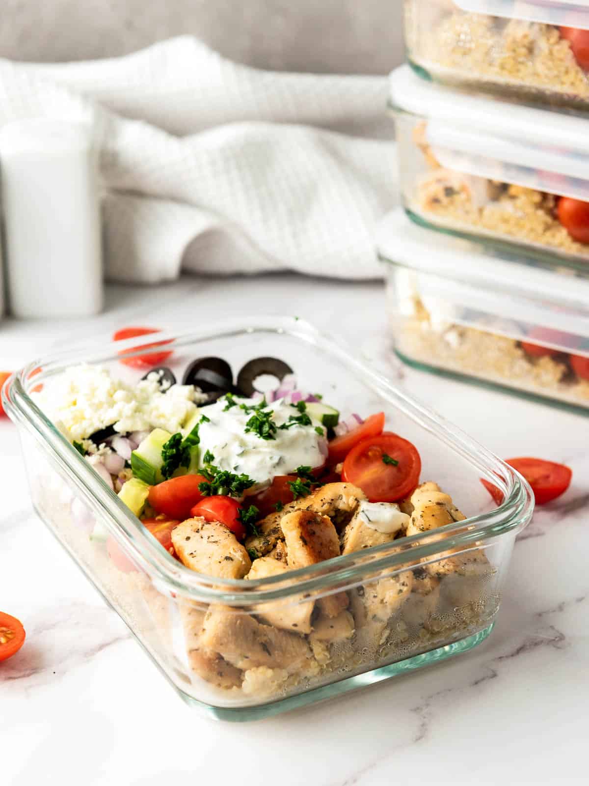 Stacked meal prep containers ready to be stored.