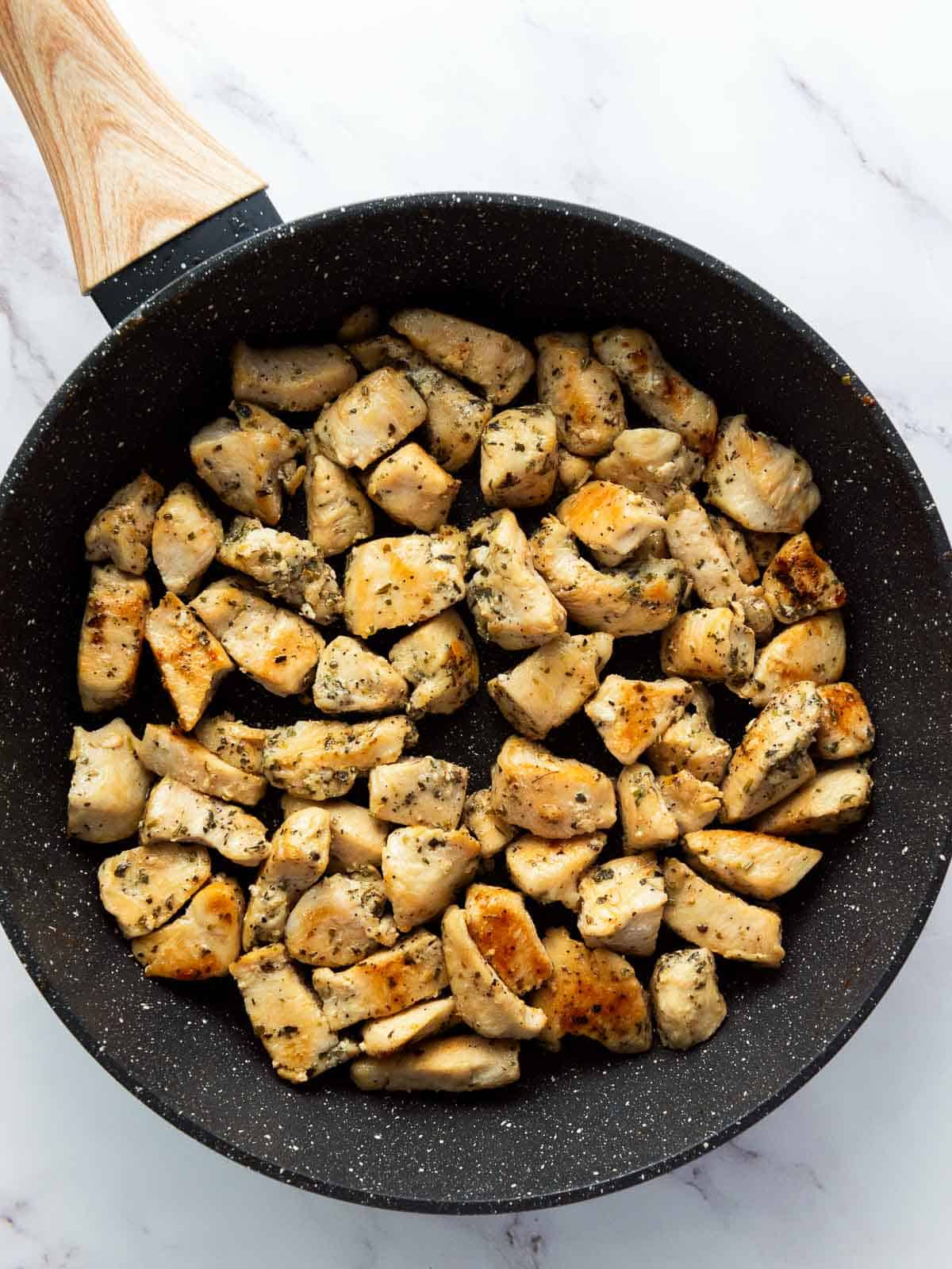 Chicken cooked in a skillet.