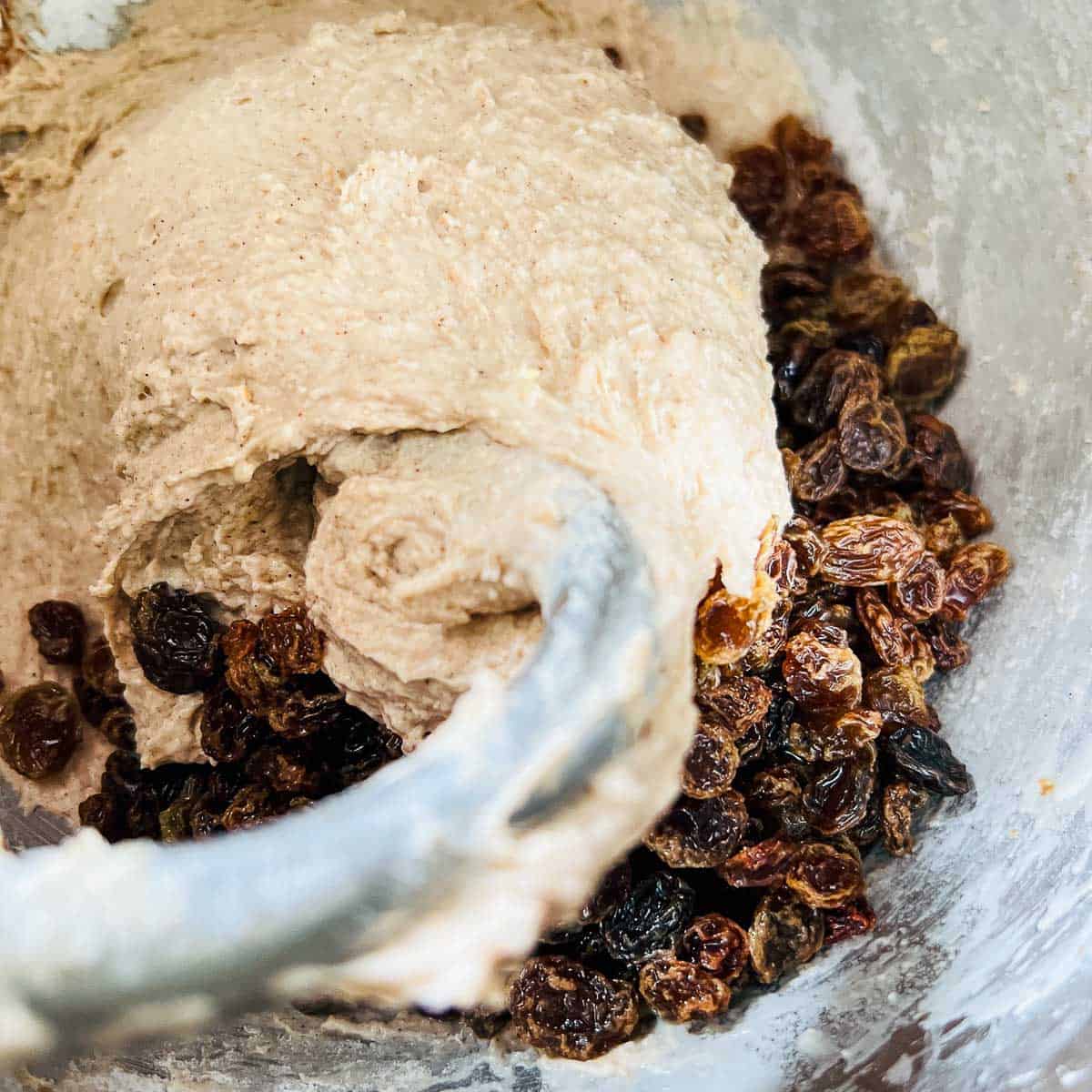 Dough kneaded in stand mixer before adding soaked raisins.