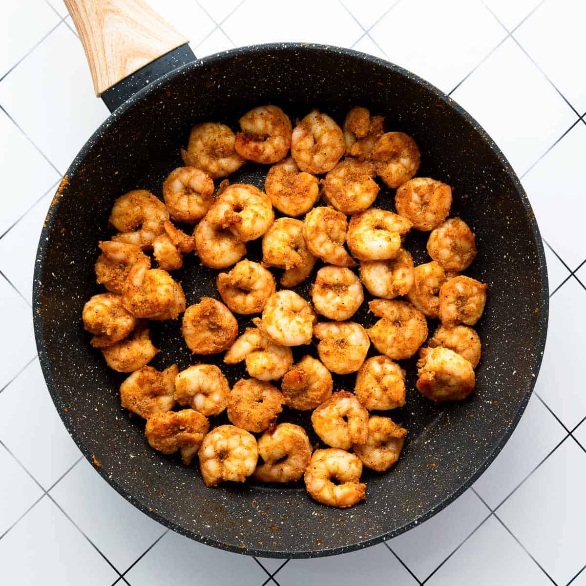 Fried shrimp in skillet.