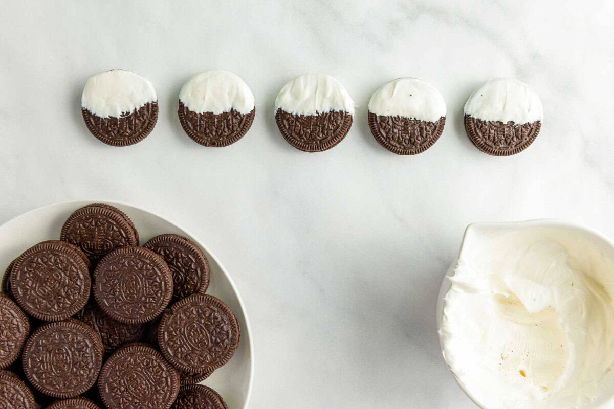 Dip the oreo in melted chocolate.