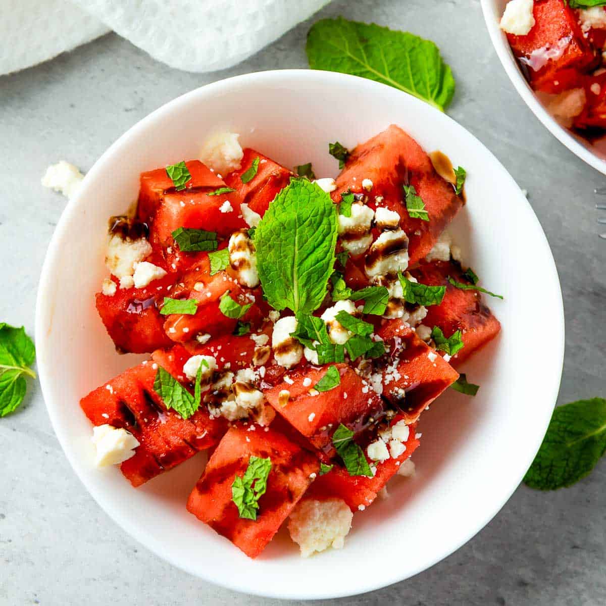 Watermelon feta salad in a white bowl.