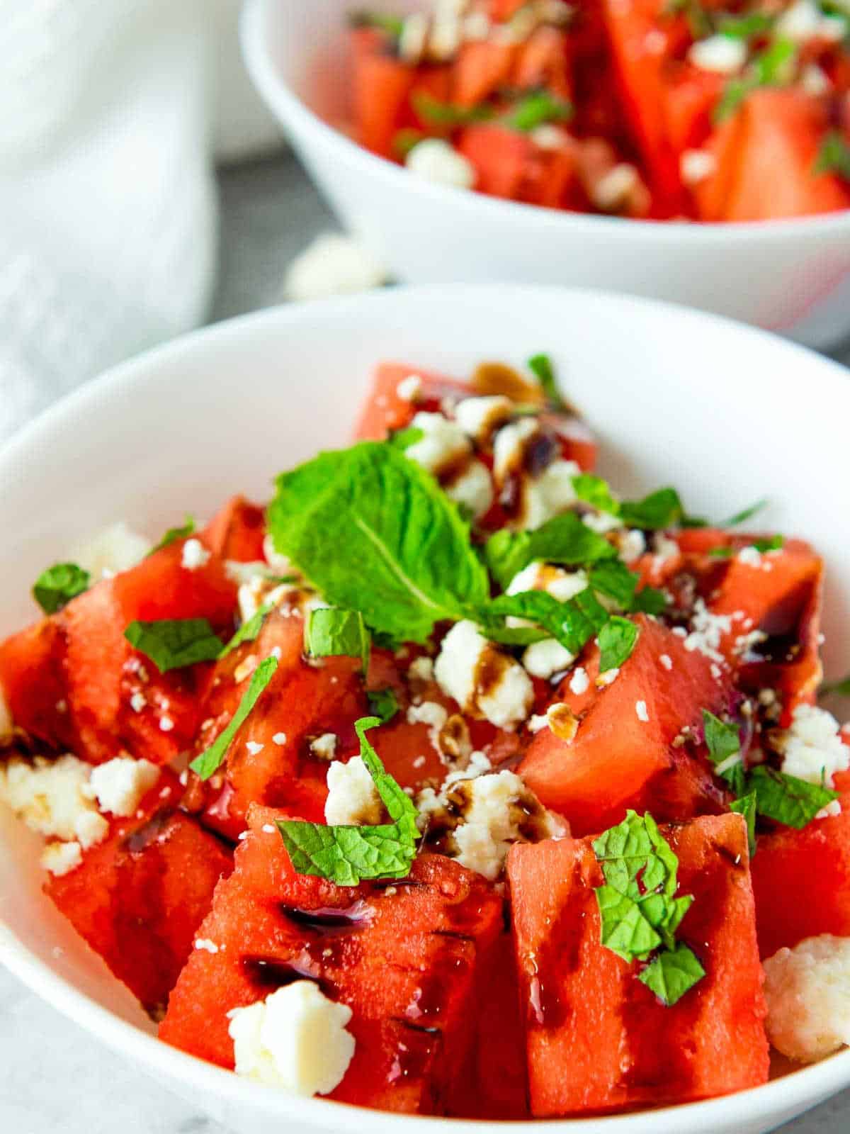 Close up of one bowl of watermelon salad.