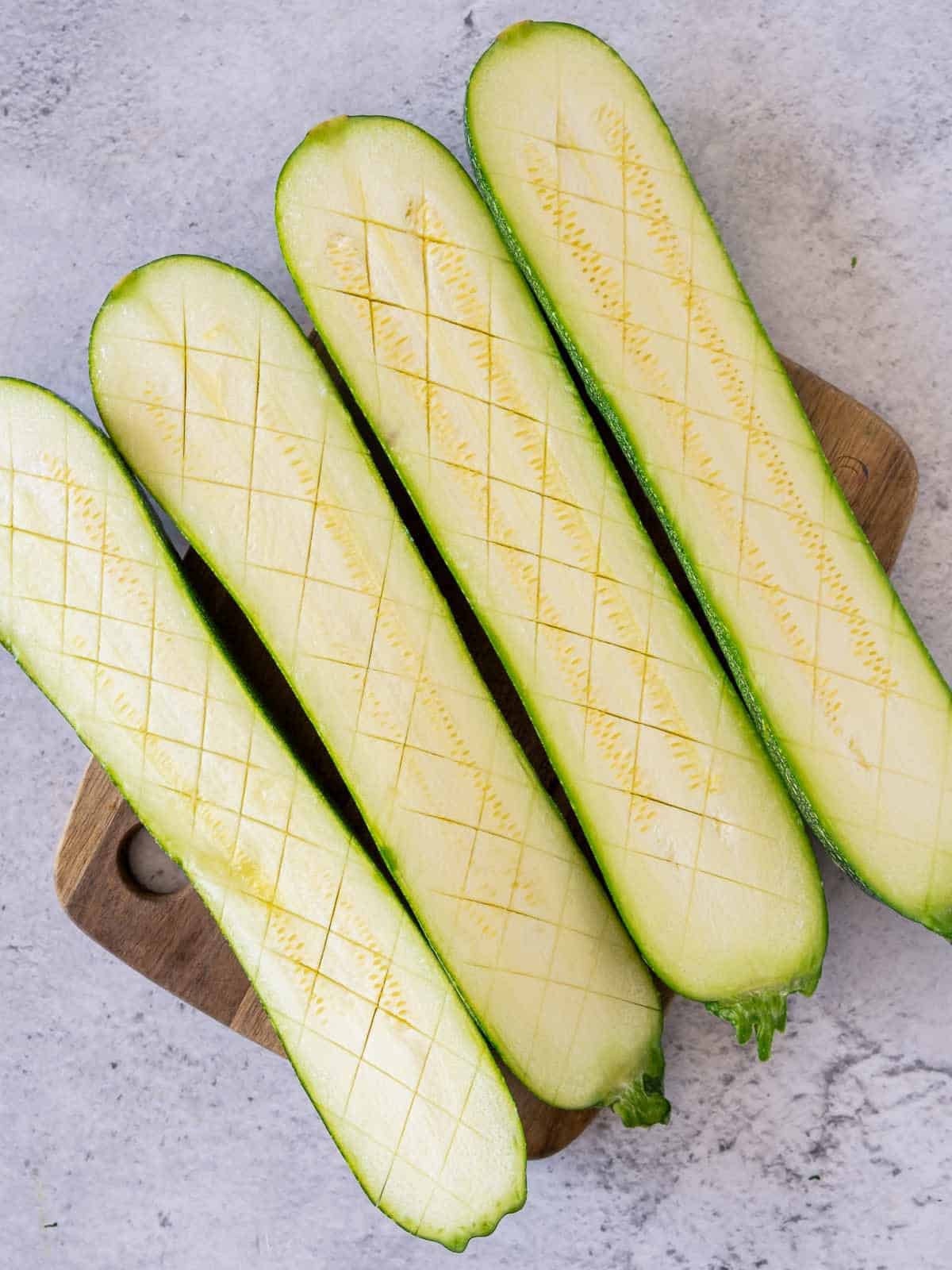 Cut zucchini on a wooden board.