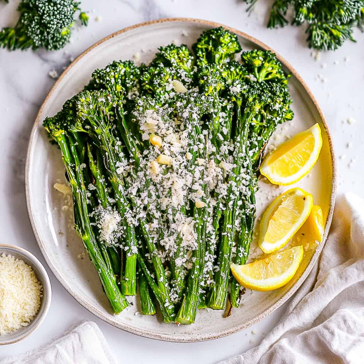 Oven-roasted broccolini topped with parmesan.