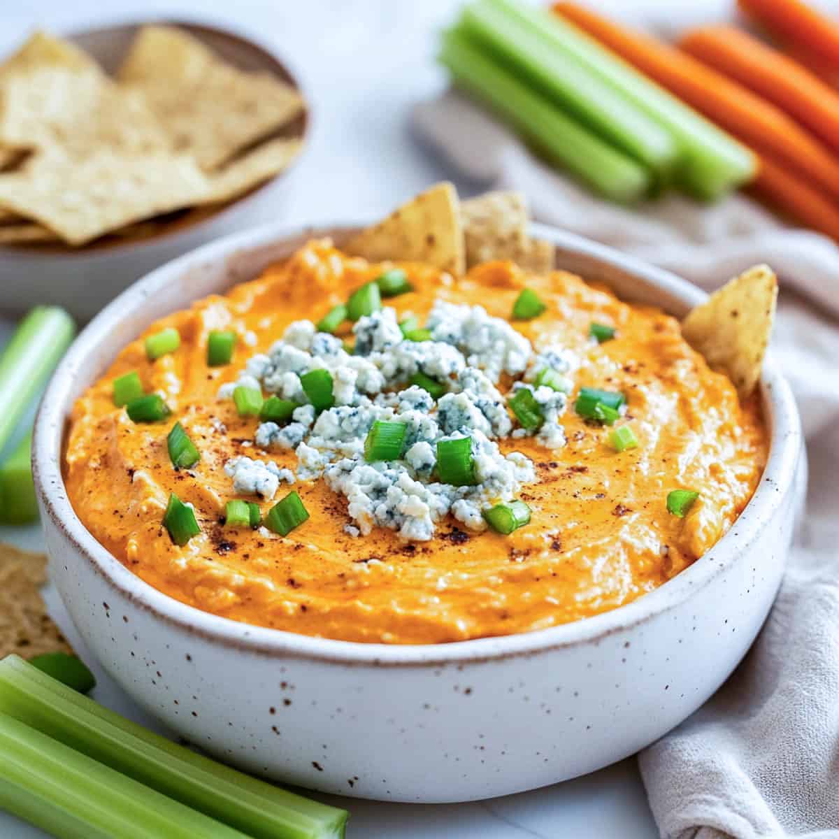 Buffalo cottage cheese dip served with dippers.