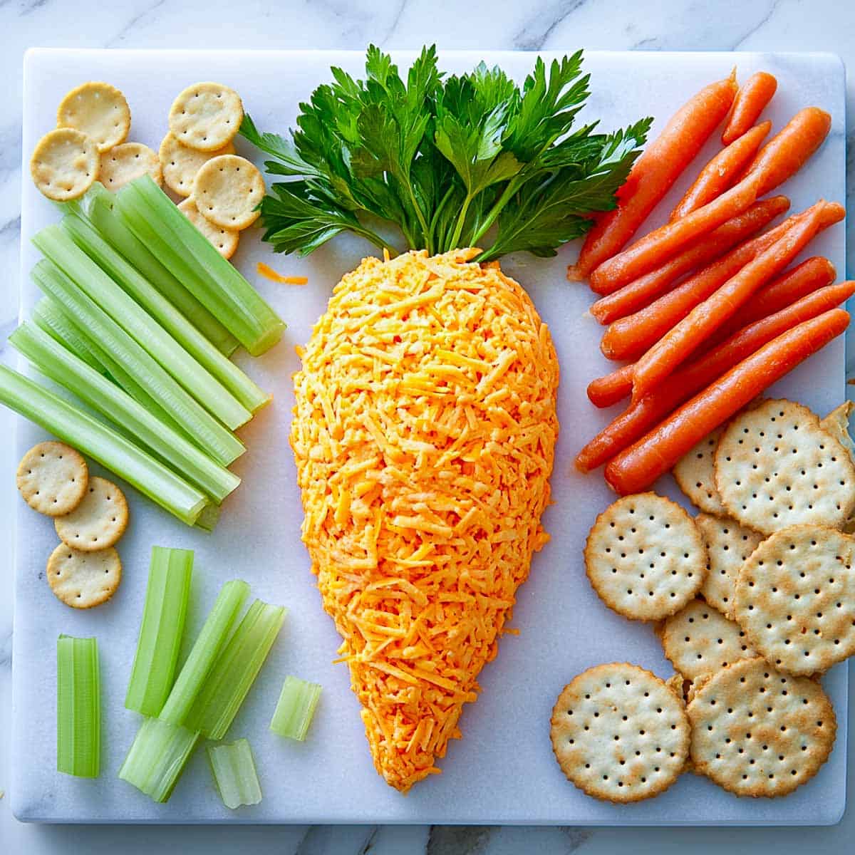 Cheese ball shaped like a carrot and served with dippers.