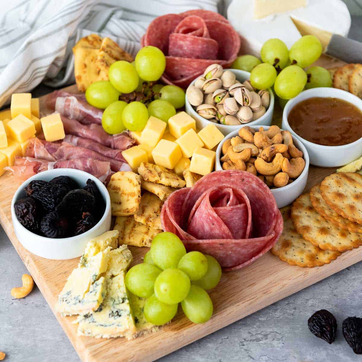 Close up of a classic charcuterie board showing all elements.